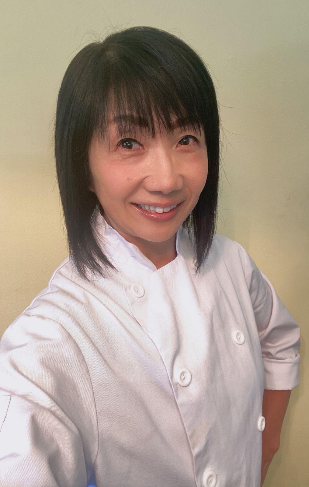 Chef Takako smiling, wearing chef's whites